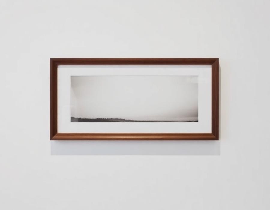 Matted photograph in a walnut frame